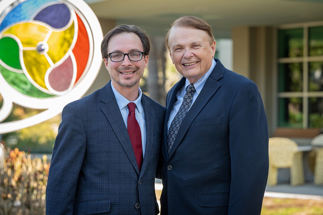 Davis Schneiderman, left, with Larry Thompson.