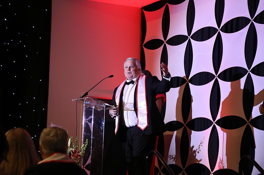 Ted Willich, CEO of NLP Logix, shows off his PS27 Corporate Innovator of the Year trophy.