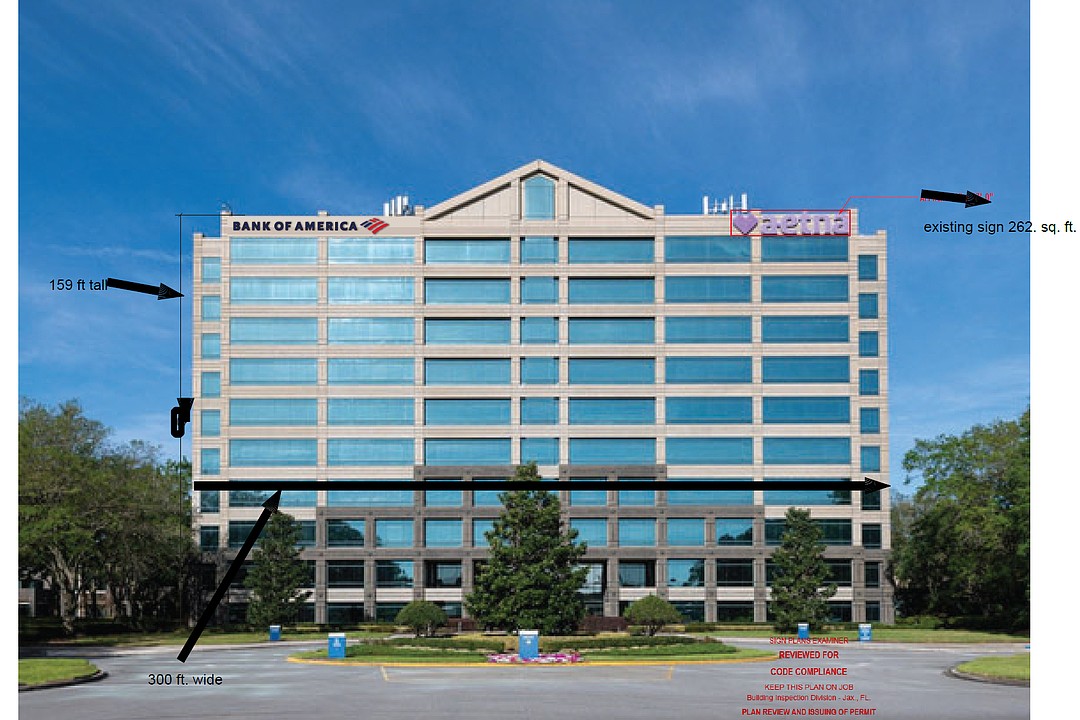 Bank of America placing signage on entry building at Gramercy Woods