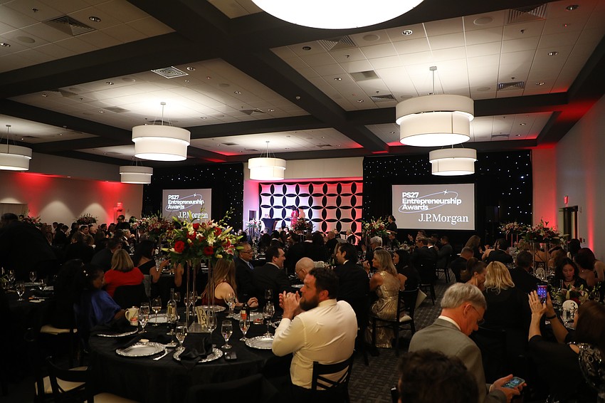The PS27 Entrepreneur Awards at St. John Event Center on Jan. 22 featured bouquets of flowers on each table, two screens displaying the current award or speaker and spotlighted the stage.