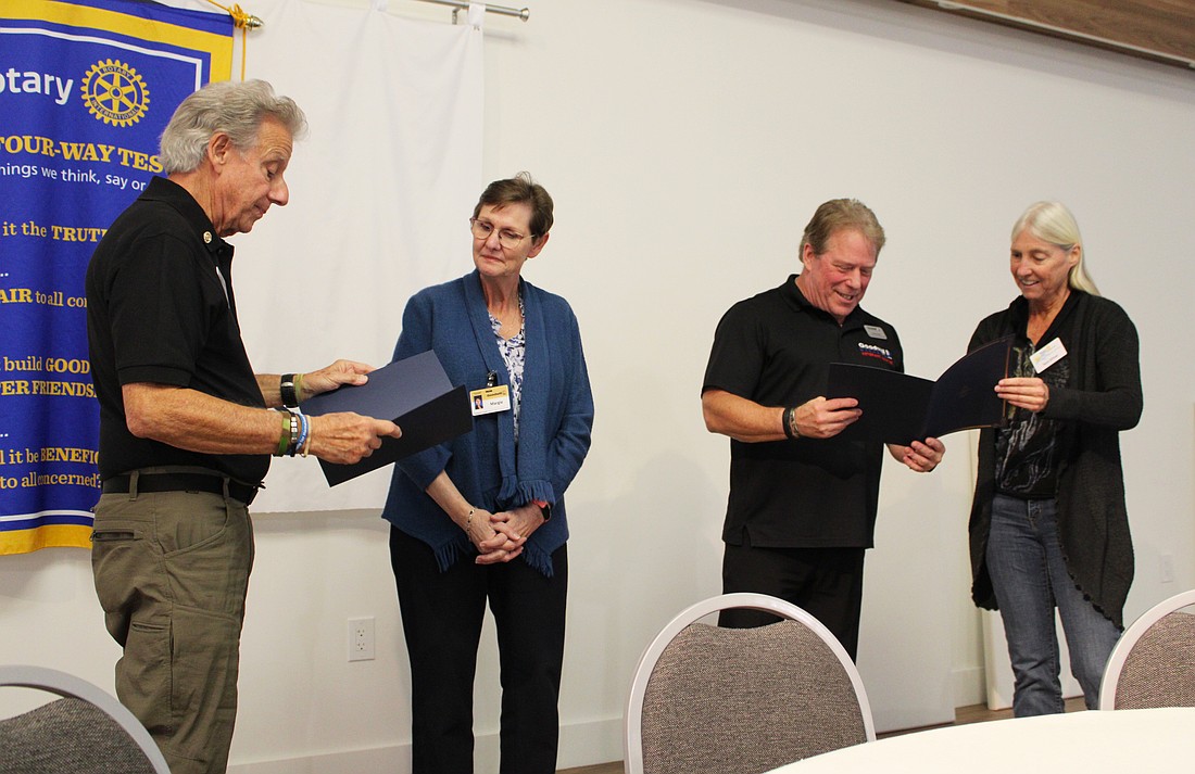 Rotarians Gene Luca, left, and President Terri Driver, right, thank Goodwill Manasota Veterans Services' Margie Genter and Randy Wright for offering insights into how it benefits community members. Representatives joined the Rotary Club of Longboat Key on Jan. 20 at All Angels by the Sea Episcopal Church.