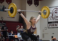 Senior Taylor Ford competes at the FHSAA Class 2A-District 12 Championship Jan. 24 at Braden River High School. She won silver in Olympic style for the 139-pound weight class as the Pirates claimed their fourth straight district title.