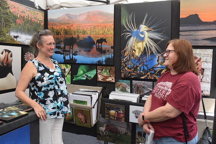 Fine Art by Jane's Jane Axman has a conversation with Lakewood Ranch's Cheryl Boncorddo about her wildlife photography. Boncorddo heard about the event on Facebook and was immediately attracted to the animals when walking by.