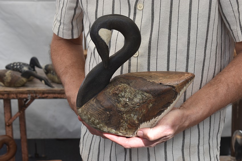 Swan Shadow, a business of 35 years, gives artist Chris Boone an opportunity to sell animals made out of logs and limbs. He is sure to leave some of the natural grains of the wood showing.