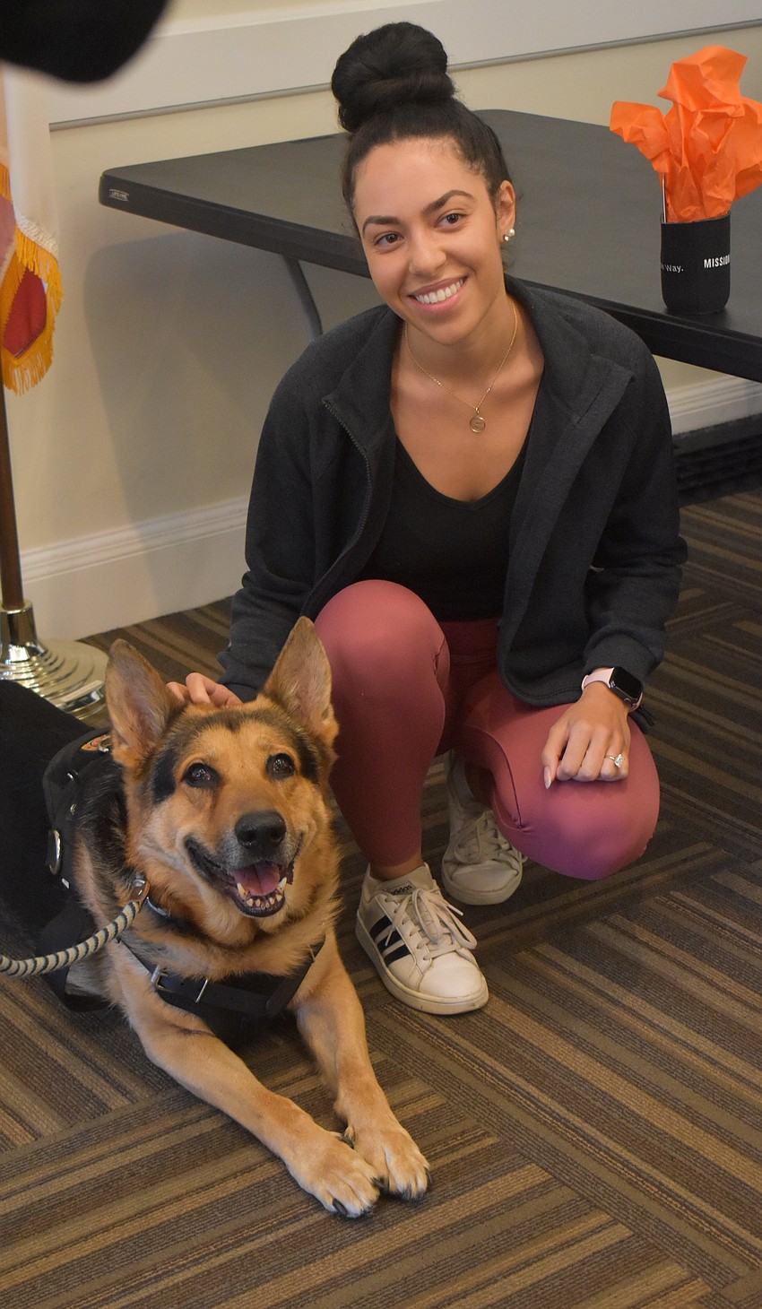 Kaido, an 8-year-old German shepherd and rescue dog, poses with Lakewood Ranch's Stephanie Saikaley. Saikaley was impressed by how docile and social both dogs were.