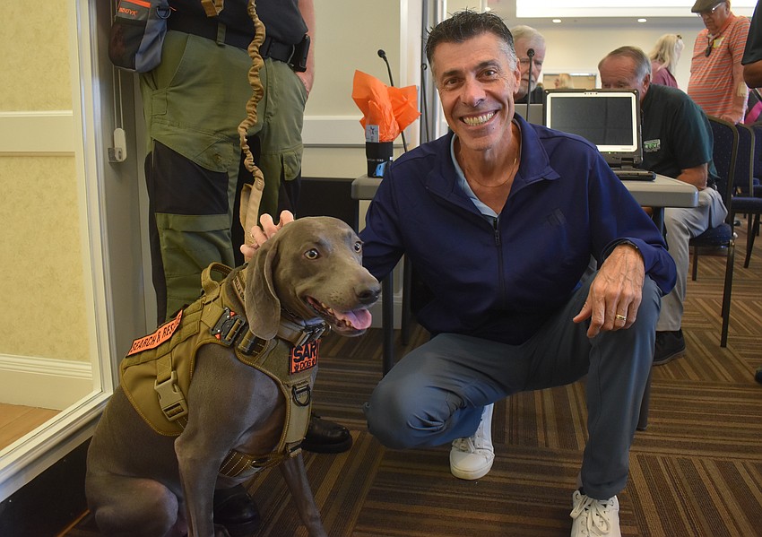 Bella Grace, a 3-year-old Weimaraner and rescue dog, poses with Lakewood Ranch's Daniel Saikaley. He was impressed how well trained the dogs were.