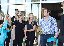 Reed Medical Group and Longboat Key Fitness both celebrated their grand reopenings on Jan. 22 at the Shoppes of Bay Isles complex, introducing visitors to their expanded facilities. Dr. James Reed, owner of the concierge medical service, wields the big scissors.