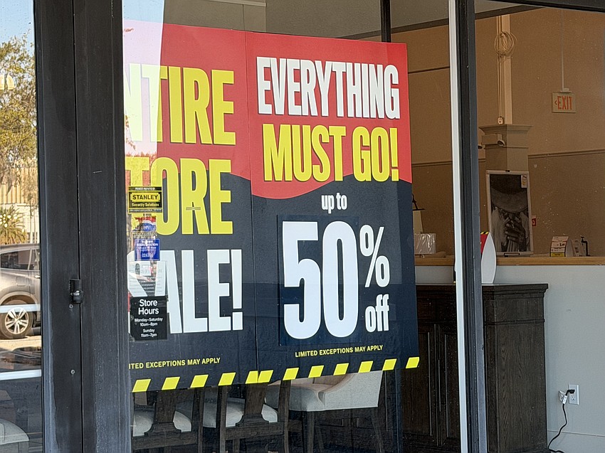 The sale signs are up at the closing American Signature Furniture at 9400 Atlantic Blvd. in the Regency Park shopping center.