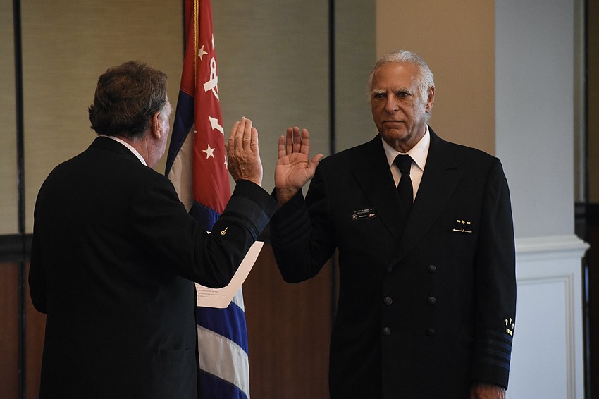 District Comander Ron Jones swears in Commander David Siesel.