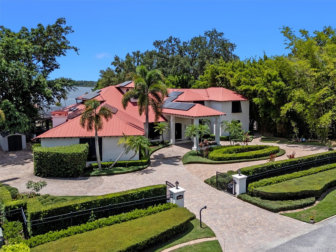 The home at 10545 Down Lakeview Circle, Windermere, sold Jan. 23, for $3,450,000. This property features 2.78 acres with fully fenced terraced grounds, electric security gates, brick pavers, and 130 feet of water frontage with a seawall, enclosed boat house, dock and lift. The sellers were represented by Valerie Kennedy, Colonialtown Realty.