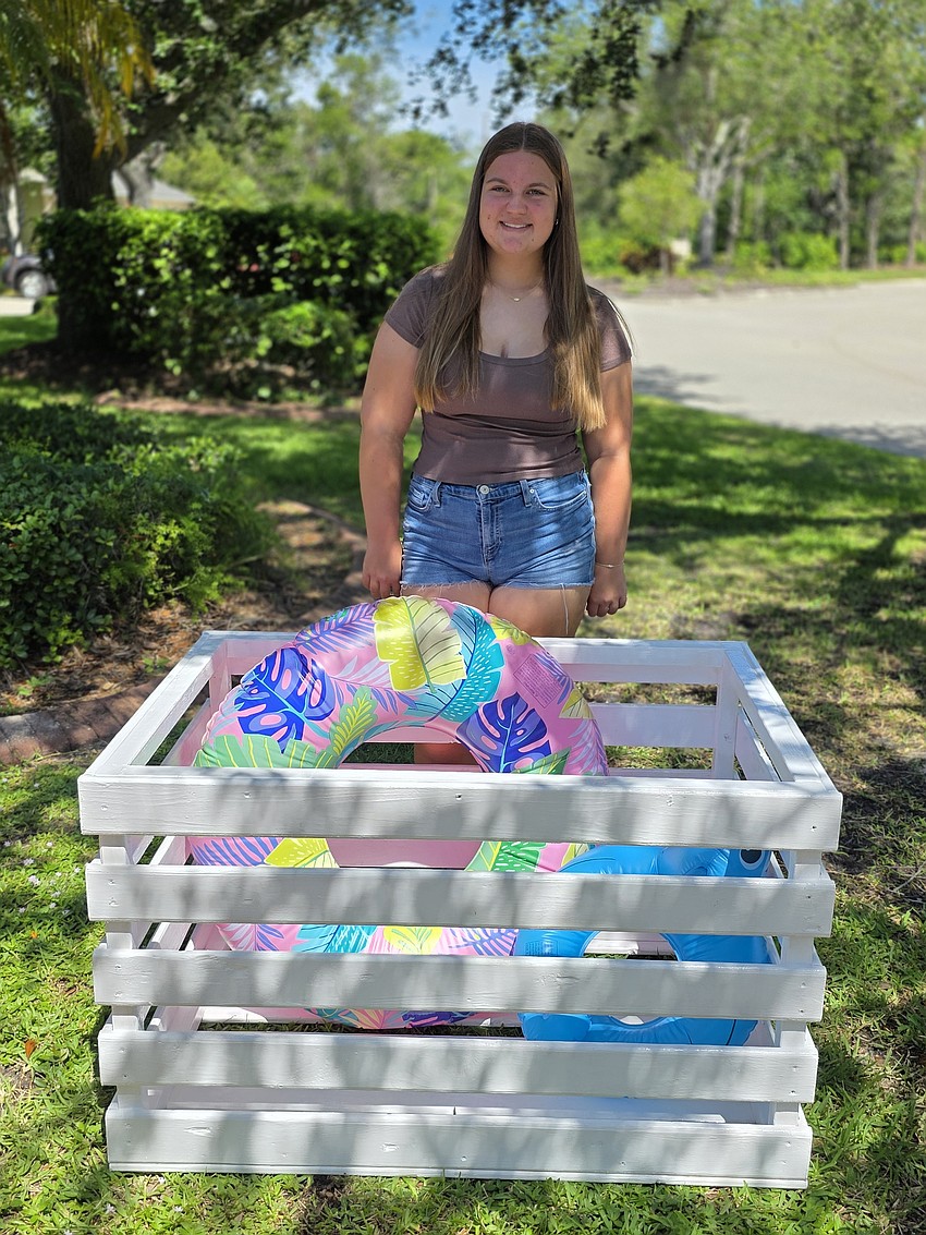 Zoe Lander, a 16-year-old junior at Lakewood Ranch High School, created a beach toy borrow bin located at Holmes Beach. The goal of the bin is to reduce plastic waste and inform the public about the environment.