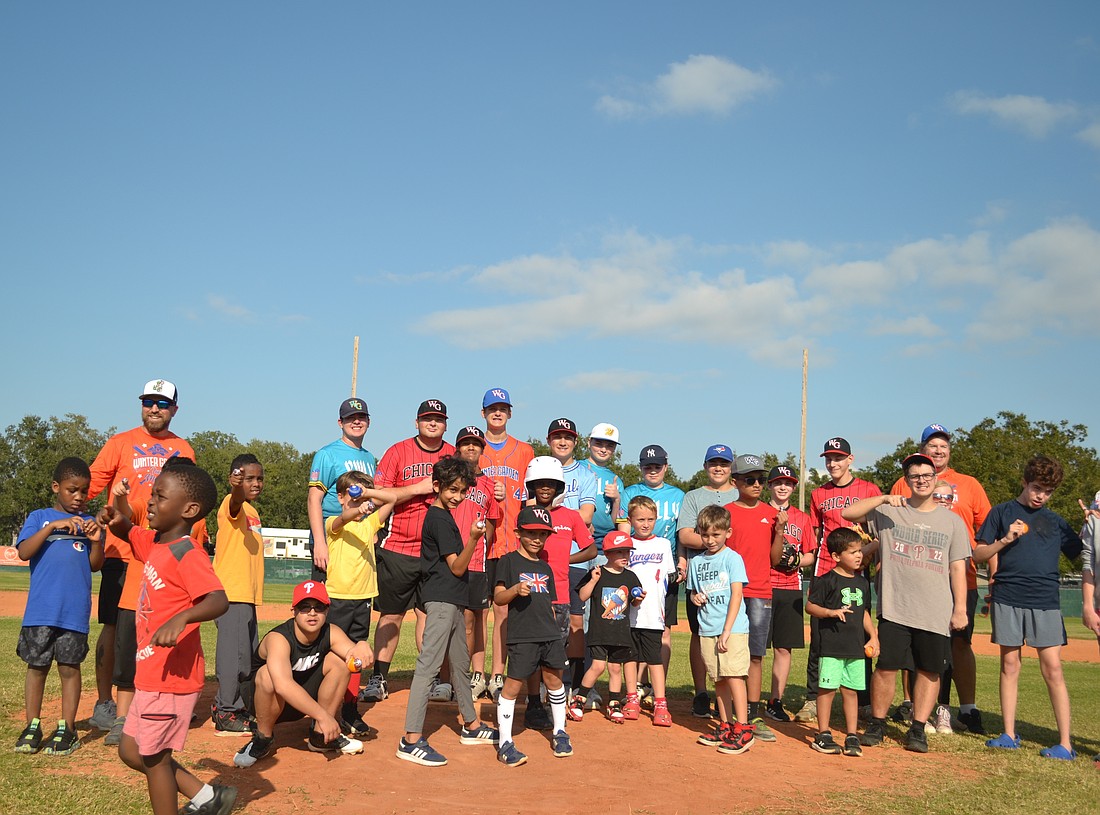 Buddies and players celebrated receiving rings at the end of the Challenger Division Showcase in November.
