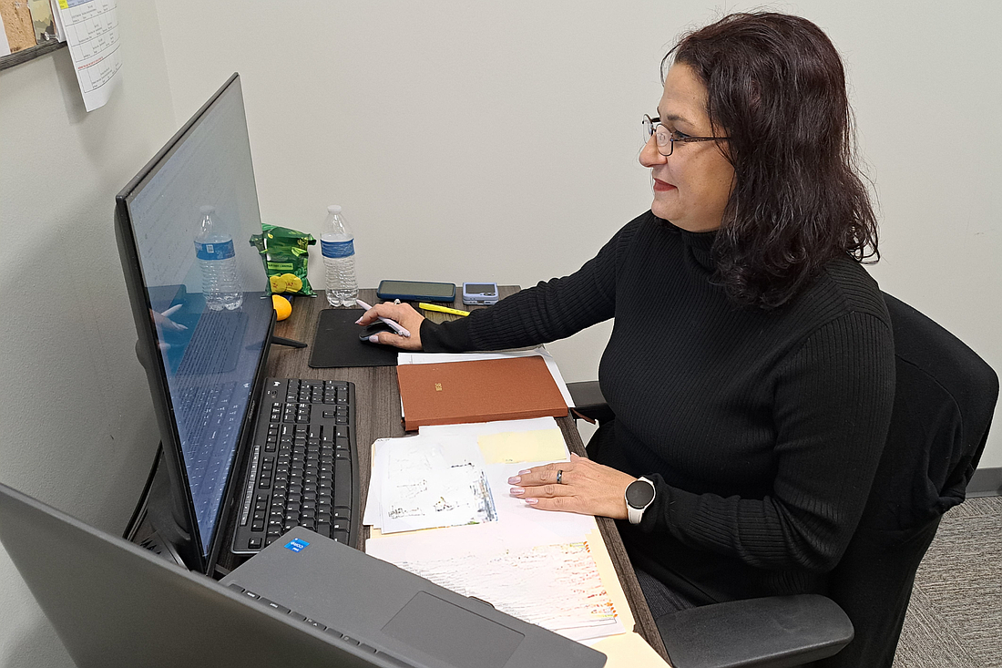 Cary Quinones, Community Investments manager for CF/UWVFC, accesses the Community Impact Grant Funded Partners List from the organization’s newly launched website. Courtesy photo