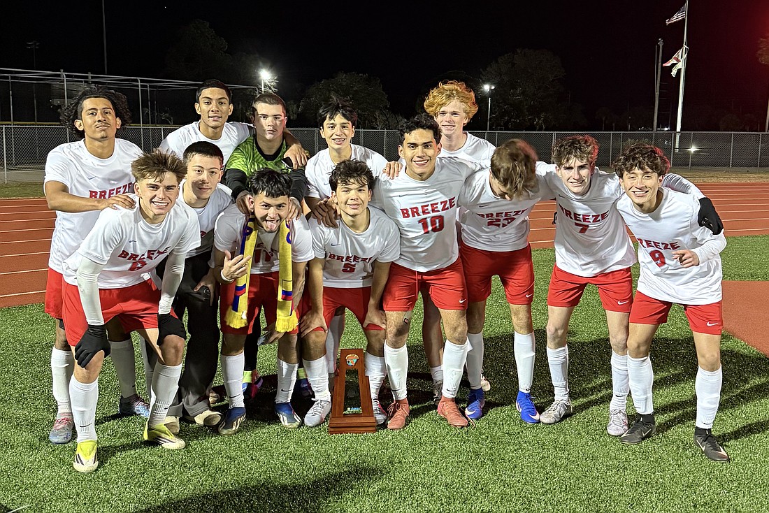 Th Seabreeze boys soccer team pose with the District 6-5A championship trophy after defeating New Smynra Beach 1-0 on Jan. 26. Courtesy photo by Elaini Harrell