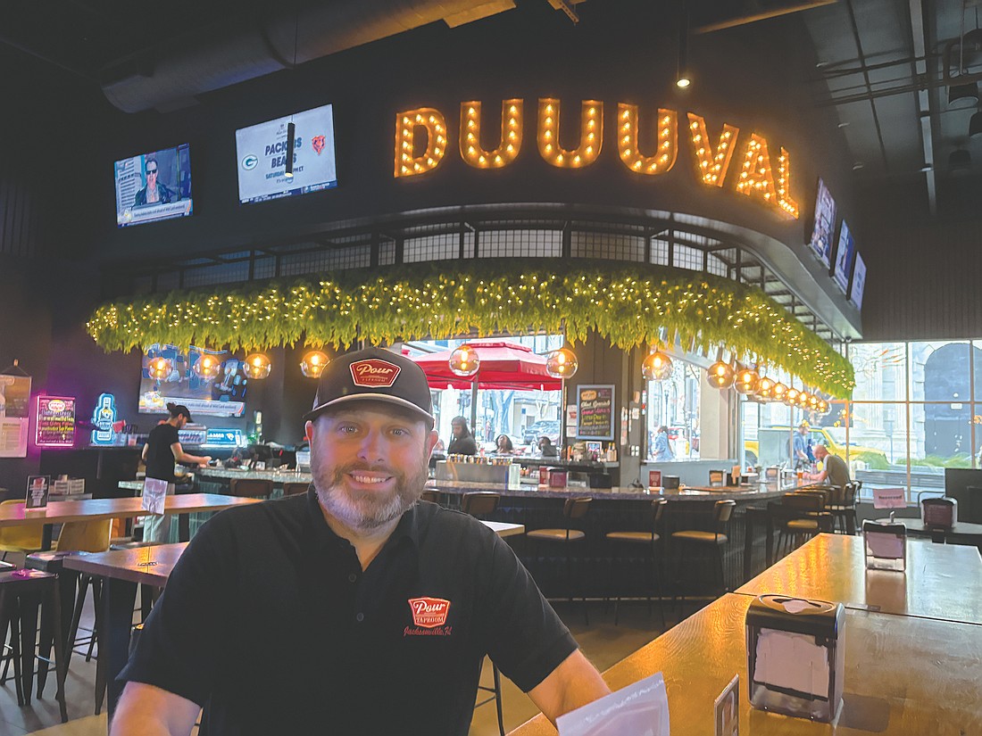 Tony Draper, above, owns Pour Taproom that opened in a connected space with Pizza Dynamo, owned by Jeremy Gatto.