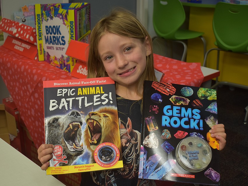 Pheebe Smith, a first grader at Myakka City Elementary, went home with two books from the book fair.