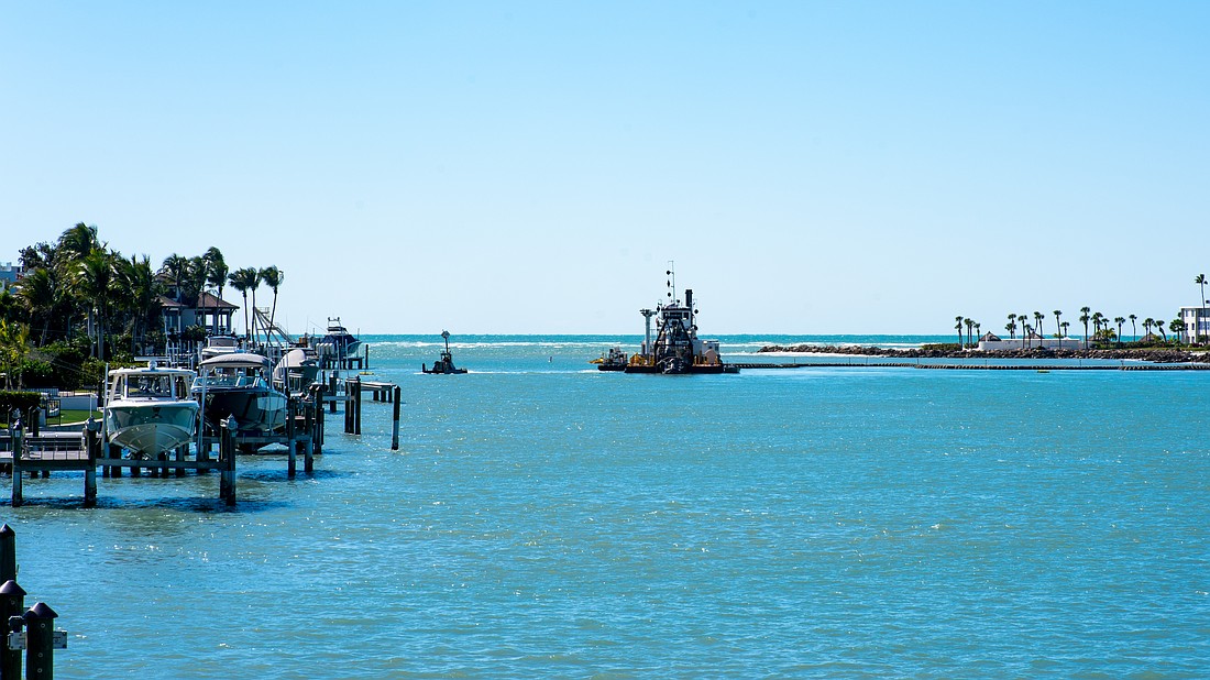 The dredging machine “Clearwater” digs a 13 foot, 180-foot-wide ditch on the bottom of New Pass, using pumps to carry the dredged sediment through miles-long pipes onto the northern end of Lido Key for a renourishment project.
