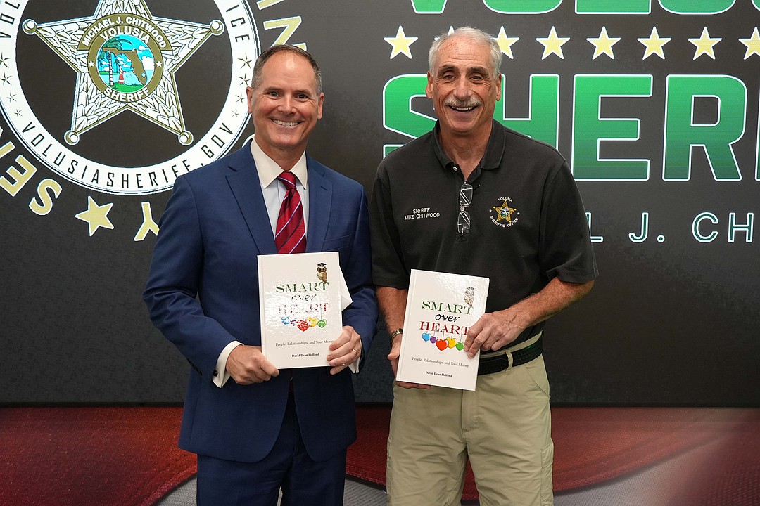 Holland Financial CEO donates over 800 copies of new book to the Volusia Sheriff's Office
