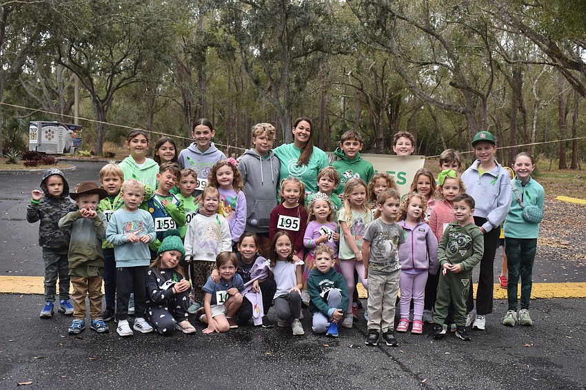 Kelly Miles was joined by current and past students she has taught during her 8 years as a teacher at All God's Children Preschool for the Miles for the Miles Family Cozy Cocoa Dash.