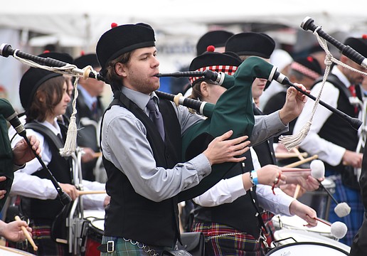 Ethan Kuhn of Suncoast United Pipes and Drums performs in the ceremony.