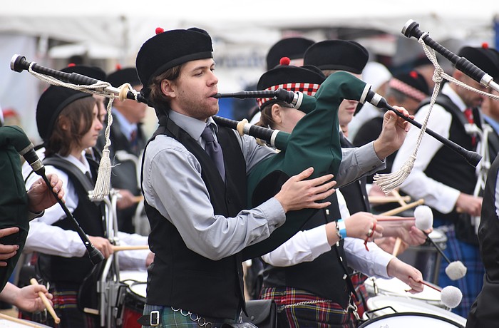 Ethan Kuhn of Suncoast United Pipes and Drums performs in the ceremony.