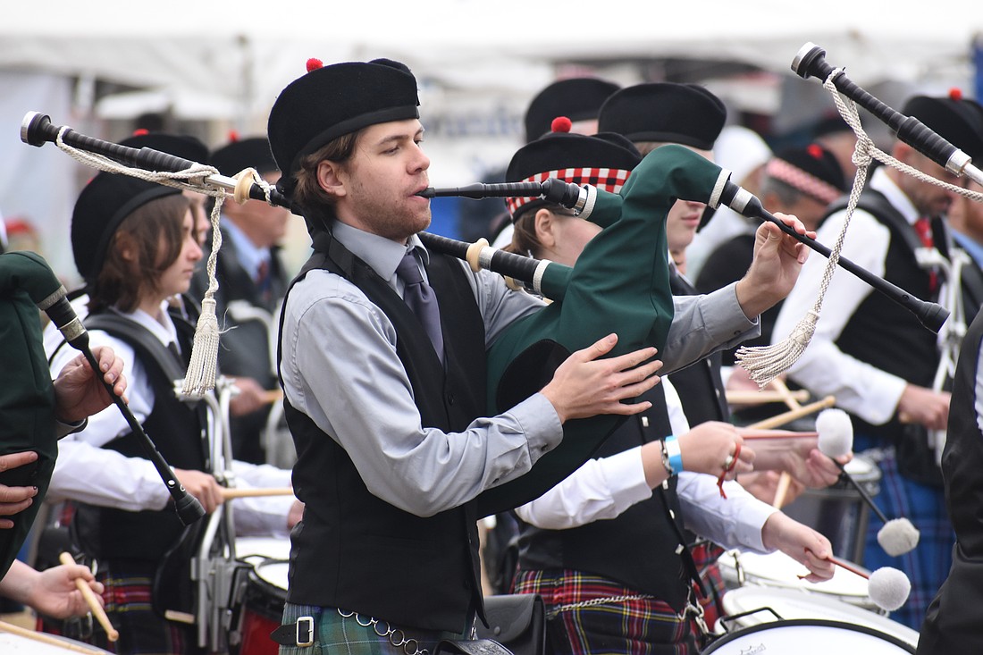 Ethan Kuhn of Suncoast United Pipes and Drums performs in the ceremony.