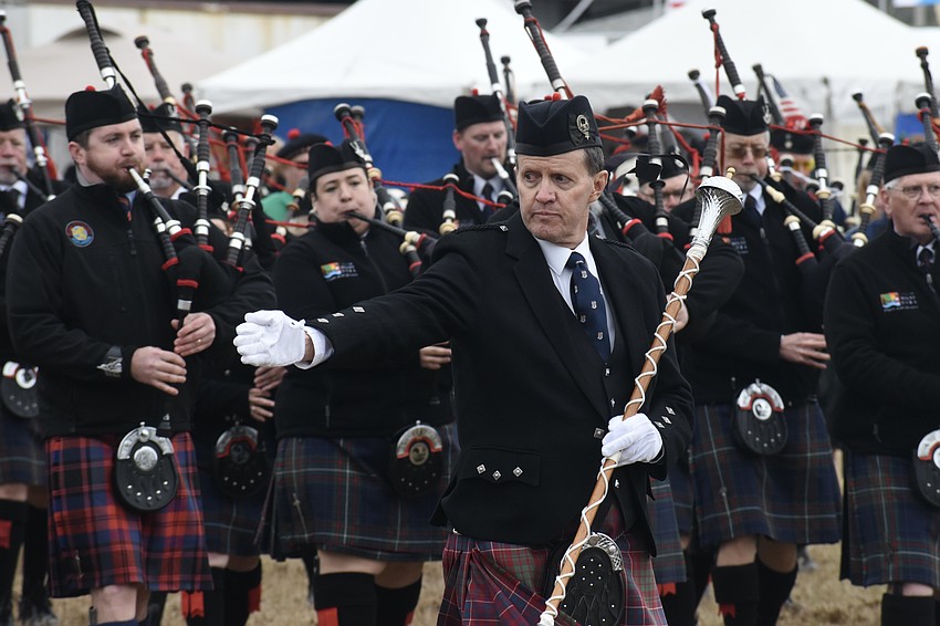 Drum Major Steve McClure leads the way in the ceremony.