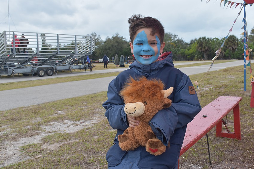 Matheson Lovell, 6, took home a Highland Coo of his own.