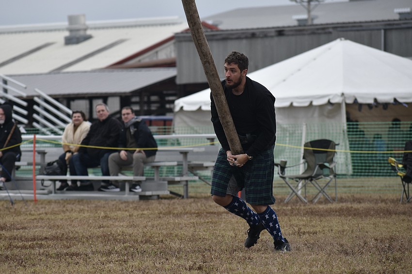 Jason Richards of Ocala tosses a caber.