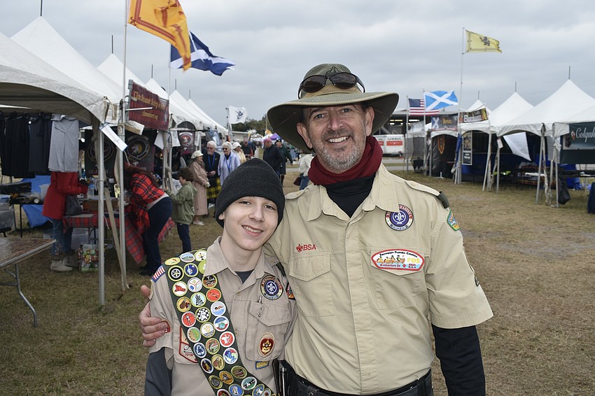Osprey's Austin Gardner, 14, of Boy Scouts of America Troop 77, and his father John Stanley, handed out water to visitors.