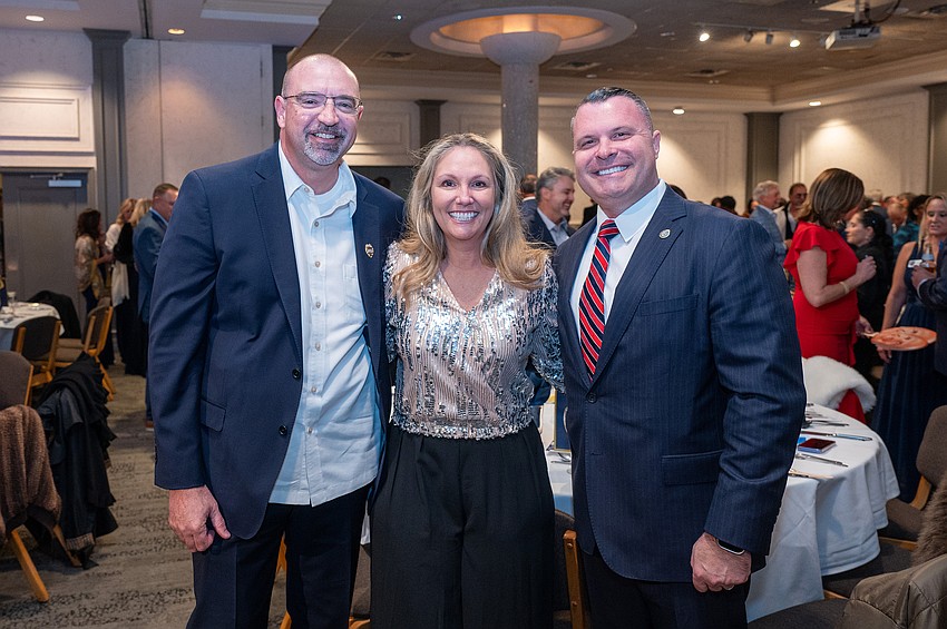 Capt. John and Heather Todd with Pat Robinson