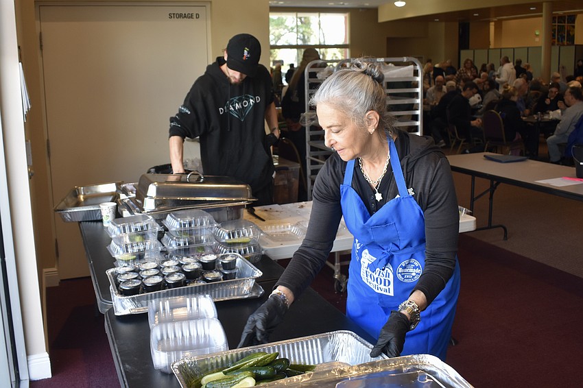 Tony Griffin and Lisa Silvershein prepare sandwiches.