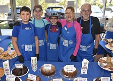 Ethan Freeman, 14, Skate Segal, 14, Jett Segal, 12, Florey Miller and her husband TJ Miller were among those serving foods baked by members.