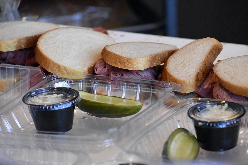 Sandwiches are set out for packaging.