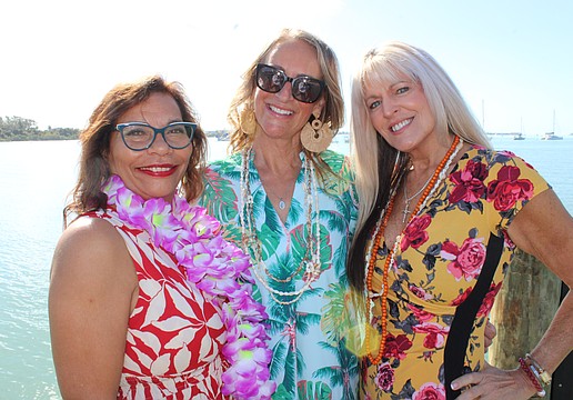 Sisterhood for Good members Nikki Pelier-Simon, Samina Morrow and Allison Adams show off some fashions that will be in the spotlight at Tropical Escape July 27 at the Sarasota Polo Club.