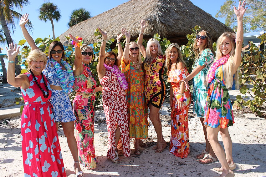 Sisterhood for Good's Angela Massaro-Fain, Stephanie Soffes, Patti Good, Nikki Pelier-Simon, Glo Reber, Allison Adams, Lori Augustyniak, Samina Morrow, and Karen Medford are ready for Tropical Escape.