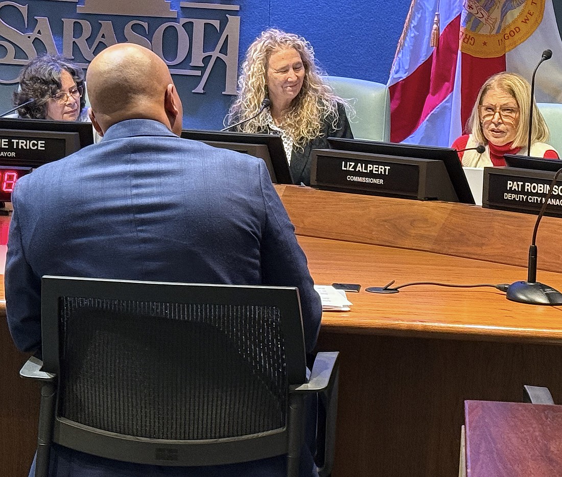 Commisisoner Liz Alpert (right) questions Parks and Recreation Director Jerry Fogle during the hearing about the Bobby Jones clubhouse design as Commissioner Jen Ahearn-Koch looks on.