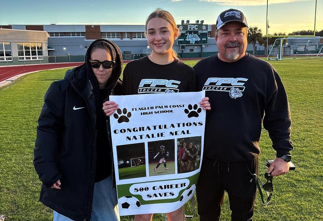 Flagler Palm Coast goalie Natalie Neal, with assistant coach Cat Bradley and head coach Pete Hald, got her 500th career save agains Creekside on Jan. 27. Courtesy photo