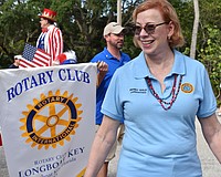 District 2 Commissioner Penny Gold walks in a parade in 2021.