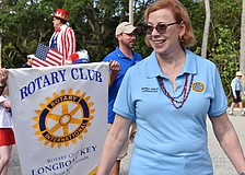 District 2 Commissioner Penny Gold walks in a parade in 2021.