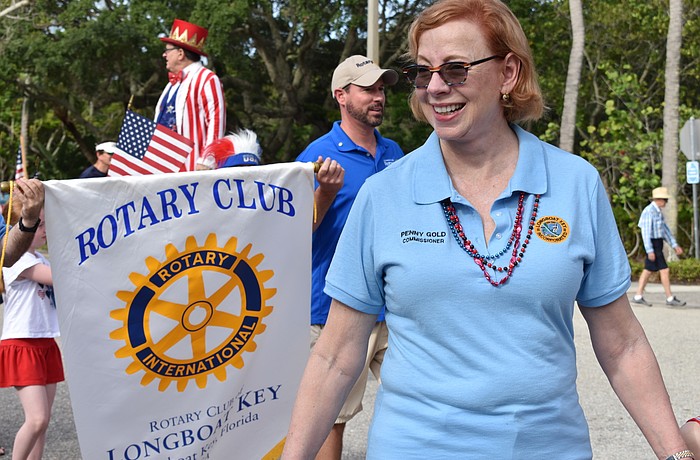 District 2 Commissioner Penny Gold walks in a parade in 2021.