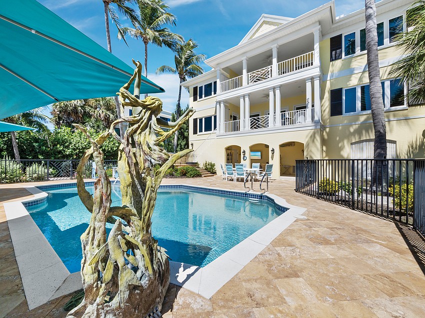 Nautical-themed sculptures provide a touch of whimsy to the pool area.