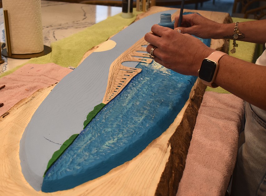 The Wesenbergs both put time and effort into creating their artwork. Whit carves the wood while Taylor chooses the colors and paints the piece.