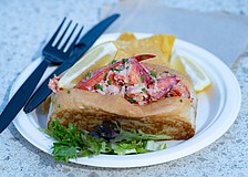 Lido Island Grill's lobster roll, filled with chilled Maine lobster and served with tortilla chips and lemon.