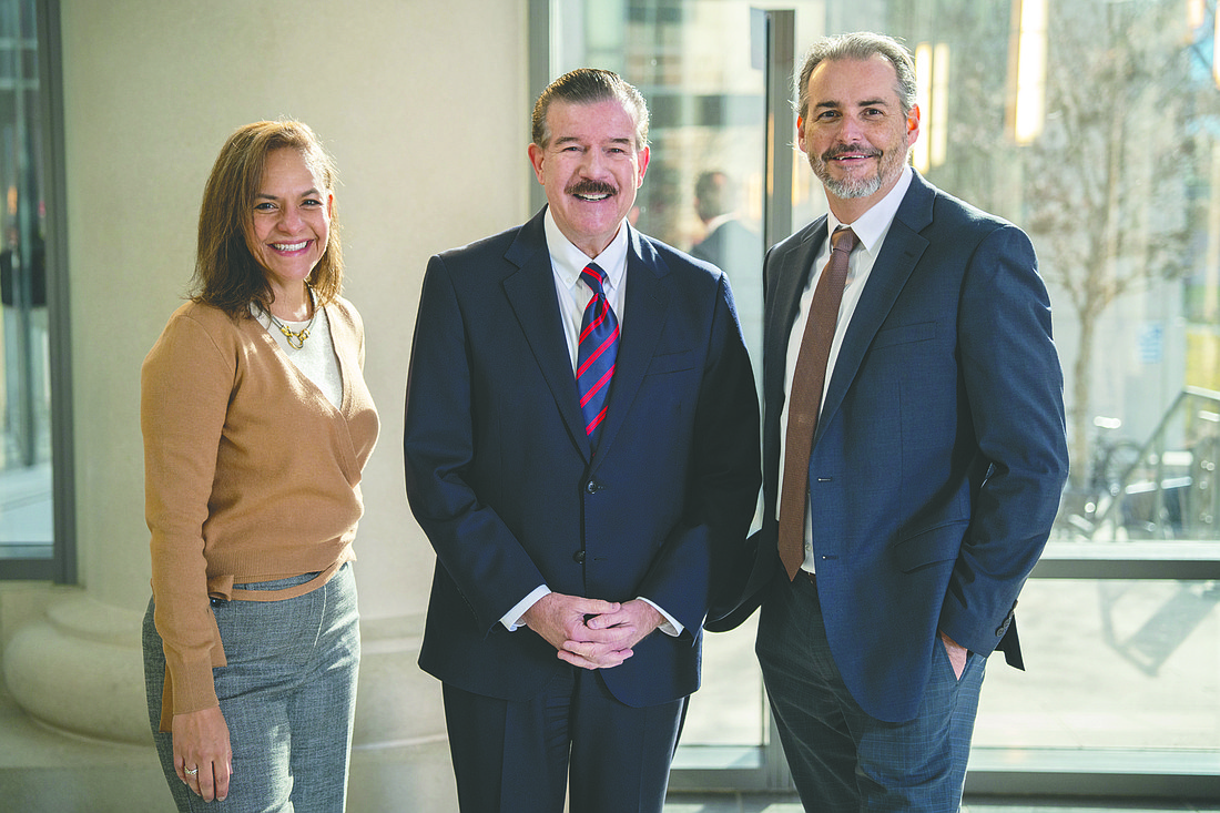 From left, new JBA Executive Director Betzy Santiago, 4th Judicial Circuit Chief Judge Lance Day and Jon McGowan, who was interim JBA executive director.