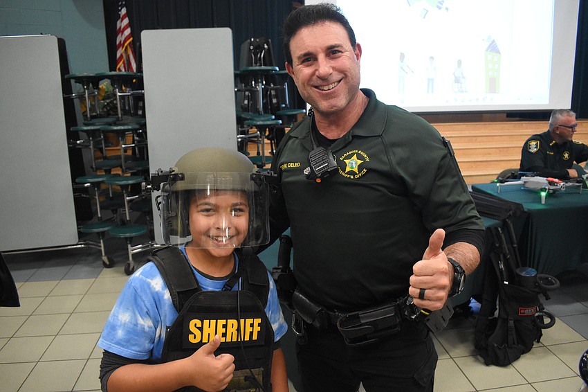 Fifth grader Gabriel Socorro poses with Deputy Michael De Leo of the Sarasota County Sheriff's Office.