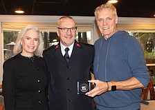 Kiwanis Club of Longboat Key President Danielle Gladding, Salvation Army Capt. Jim Curry and bellringing coordinator Chris Sachs, a former club president, celebrate a stand-out year for donations.
