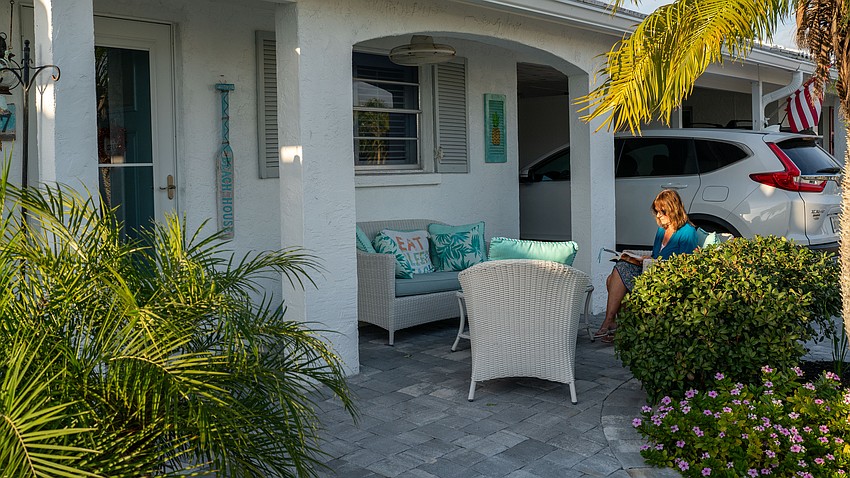 Spanish Main resident Anne Hasenfus can often be seen sitting on her front patio reading. Hasenfus, an 11-year full-time resident at Spanish Main, said the people who live in the community have a bond that she hasn’t seen anywhere else.