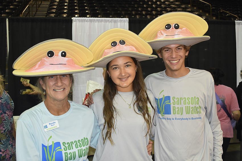 Ronda Ryan, Amanda PIzaroo and Jackson Mitchell of Sarasota Bay Watch put on their shell hats.