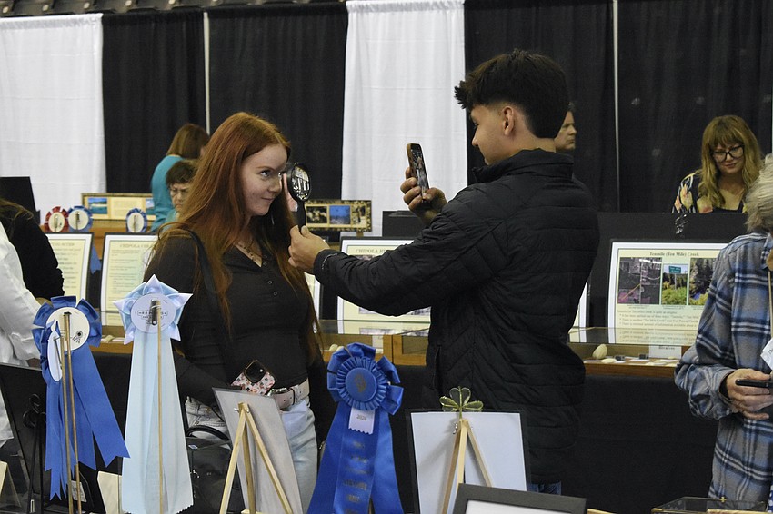 Liberty Pence and Dylan Infante have a moment of fun in the section for scientific shells.